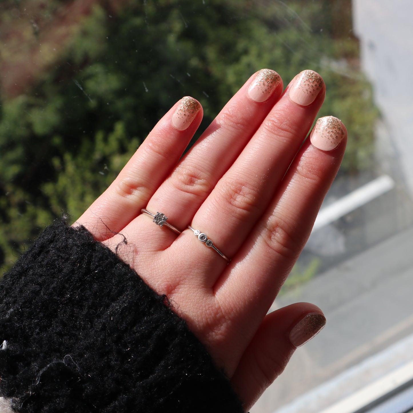 The model is wearing PeachPuff - Gel with Golden Tip on top of it.